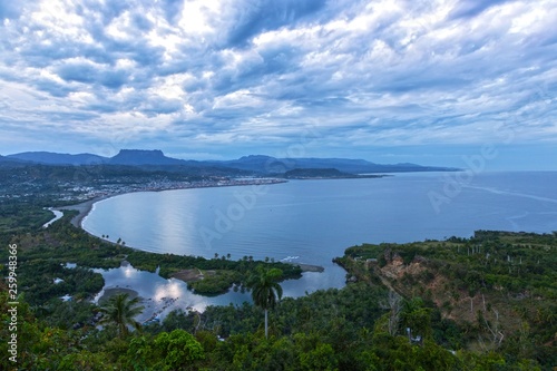 Landscape View of Baracoa Bay and Dramatic Stormy Sky on Caribbean Coast of Cuba from Parque Natural Majayara Viewpoint
