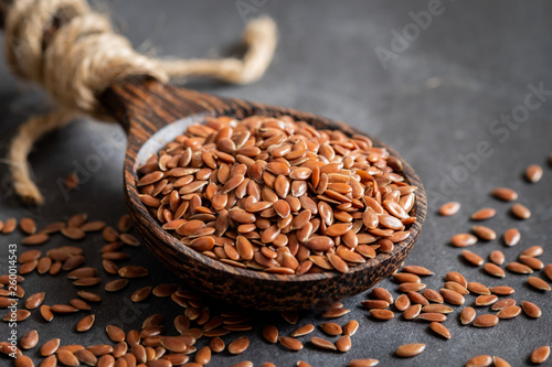 Flax seeds on wooden spoon