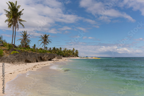 exotic rocky beach and coastline with blue and turquoise water, crystal clear water, a tropical tranquil relaxing scene