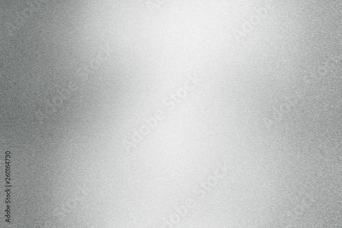 Abstract texture background, light shining on rough silver steel wall