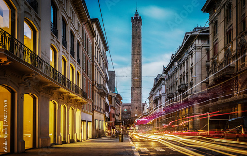 Two famous falling Bologna towers Asinelli and Garisenda. Evening view. Bologna, Emilia-Romagna, Italy. Long exposure, time lapse.