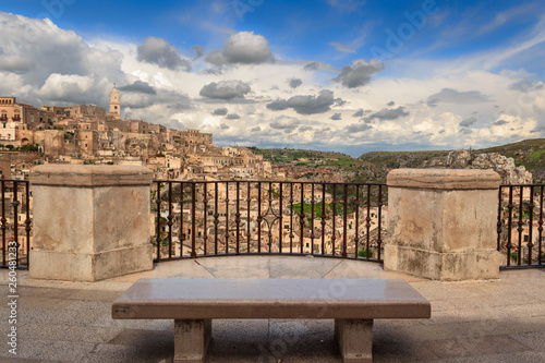 Panoramic view of the ancient town of Matera (Sassi di Matera), European Capital of Culture 2019. Belvedere with blue sky and clouds, Basilicata, southern Italy.