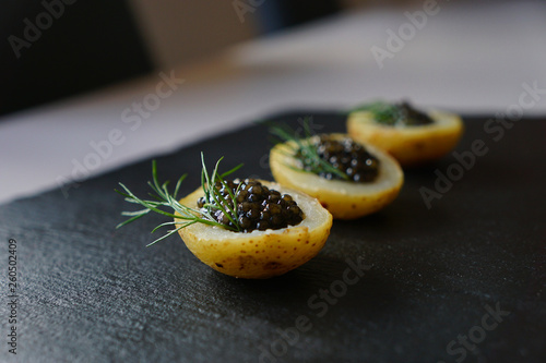 black caviar on potatoes 