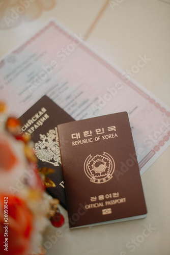 Passports of different countries in the registry office. Inter-ethnic marriage