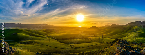 Panorama of Setting Sun on Rolling Green Hills