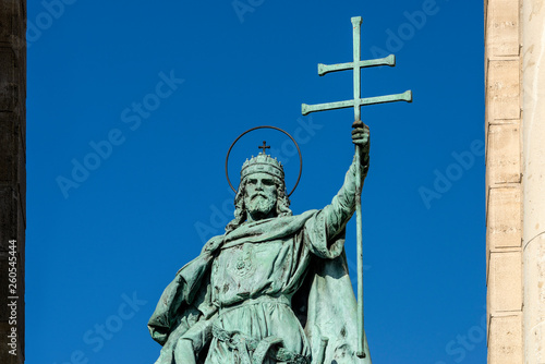 Hungary, Budapest, Hosok tere: Statue of King St. Stephen I as part of the left colonnade at famous Heroes' Square in the sunny city center of the Hungarian capital with blue sky in the background.