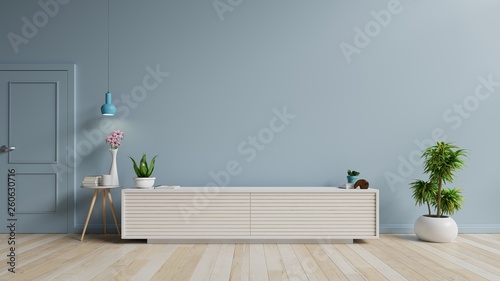 Tv cabinet in modern empty room on blue wall background, 3d rendering