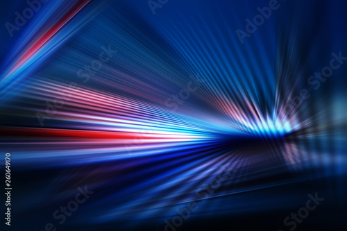 abstract dark background of light with stripes of colourful rays moving from the center