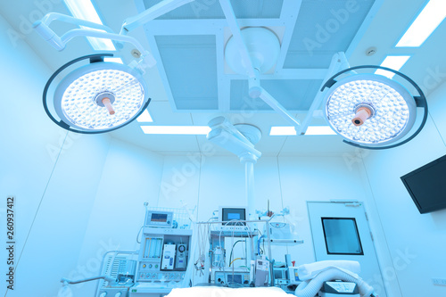 Equipment and medical devices in modern operating room take with art lighting and blue filter