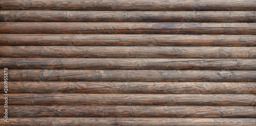 Wooden wall assembled of beams or logs