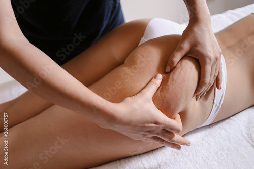 Anti cellulite massage for young woman in beauty salon. Perfect skin fat burning beauty concept