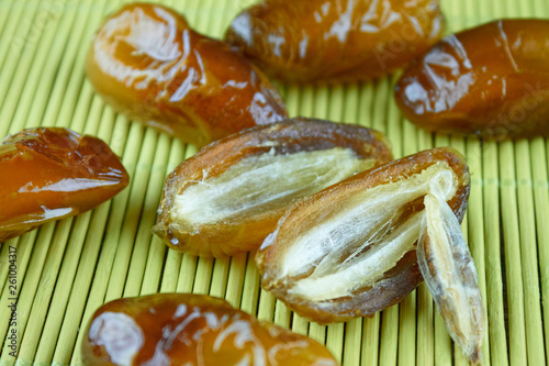 sweet algerian arabic split dates fruits open on a wooden ground