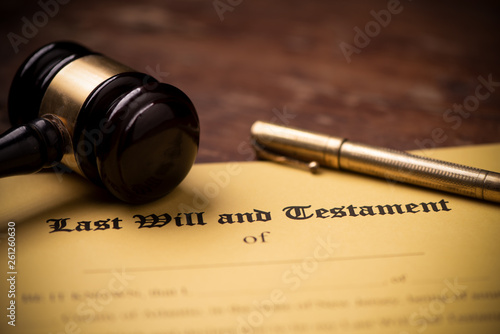 Last will and testament form with gavel. Decision, financial