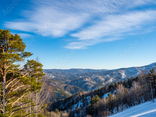 View from Tserkovka mountain to the Altai Mountains in winter in resort Belokurikha on Altai, Russia