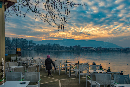 Sunset on lake Pamvotis at a wintry day. Ioannina city, Greece