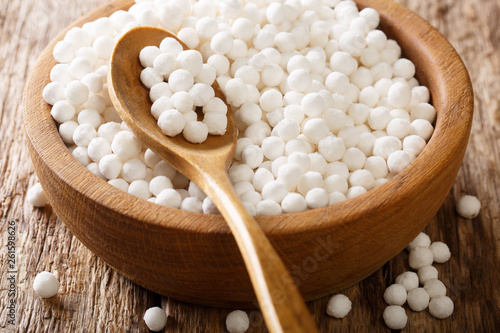 Organic tapioca pearls close-up in a bowl on a table. horizontal