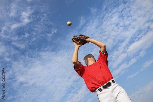 Boy catching a baseball