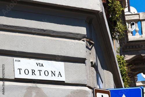 Milan, street sign, Via Tortona - marble panel with the road name. Tortona district important for the fashion and design sectors, Lombardy Italy