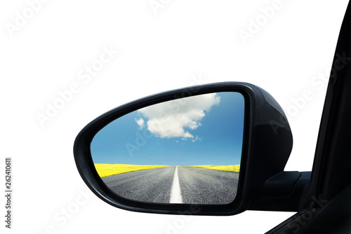 Wing mirror of a car with beautiful panorama reflected