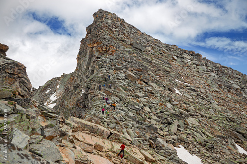 Some mountaineers climb the ridge of Punta Violetta, in the Gran Paradiso park, in Italy.