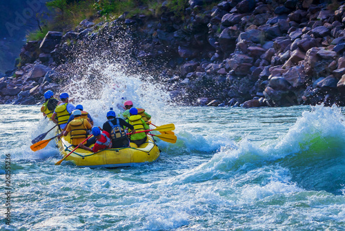 White water river rafting in Rishikesh, India. Sports activity by group of tourist.