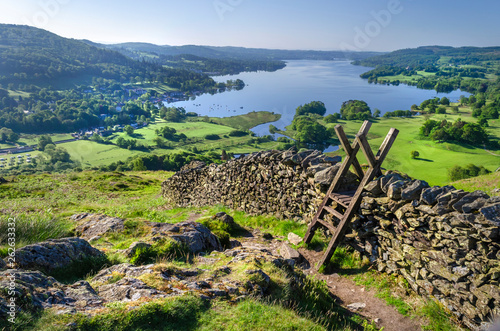 A morning shot of Lake Windermere showing the stone walling and the stile providing passage over the wall. 