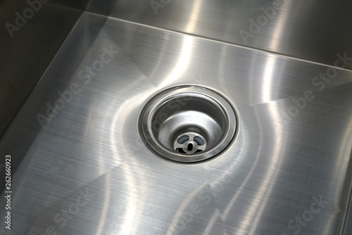 close up on stainless steel drain in kitchen sink