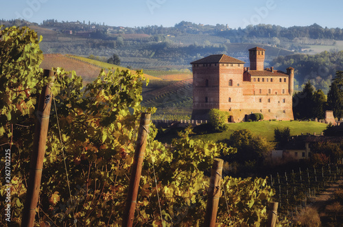 Sunset in autumn, during harvest time, at the castle of Grinzane Cavour, surrounded by the vineyards of Langhe, the most importan wine district of Italy and Unesco Heritage for its landscape