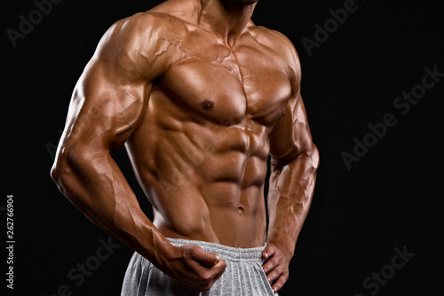 Strong Muscular Men Flexing Muscles