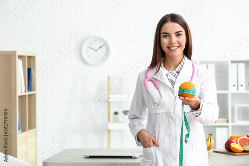 Portrait of female nutritionist in her office