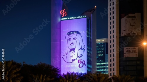 Styalised image of Sheikh Tamim bin Hamad al Thani on the side of a building in central Doha
