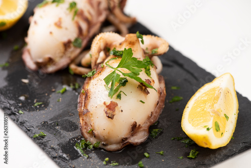 Delicious BBQ cuttle fish on a stone dish