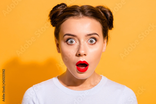 Close-up portrait of her she nice attractive lovely puzzled girl opened mouth stunning news isolated over bright vivid shine yellow background