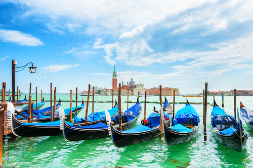 Gondolas on the Grand canal near San Marco square in Venice, Italy. San Giorgio Maggiore Cathedral in the background
