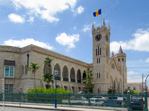 The old historic building is a fortress with a tower and clock. The Parliament Building Of Barbados. Little Big Ben. The capital of Barbados is Bridgetown, Caribbean.