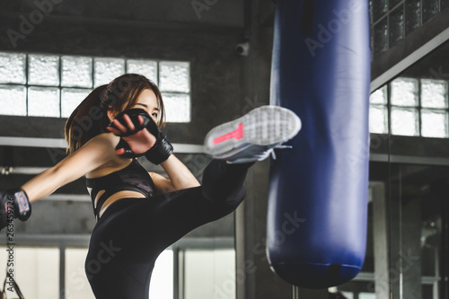 Athlete woman doing kick boxing training