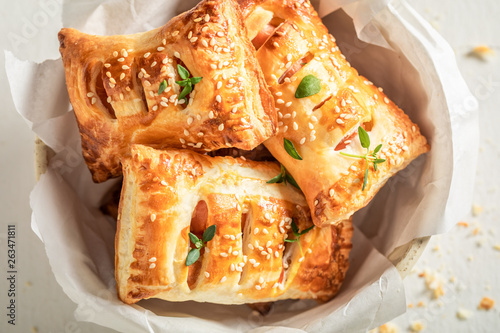 Delicious sausage in puff pastry as a snack for breakfast