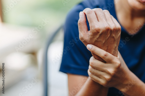 Close up young woman wrist pain, health care concept