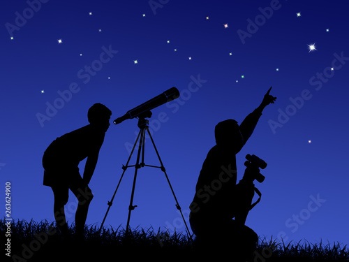 father and son study the starry sky