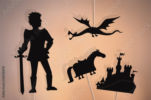 Dragon, knight, castle and horse shadow puppets.