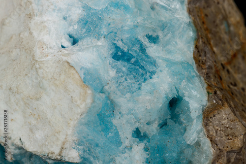 Macro stone cobalt calcite mineral on a black background