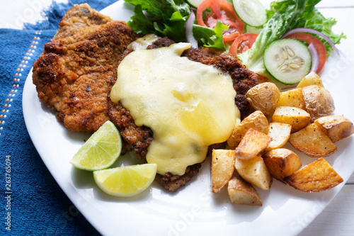 Traditional milanese beef and french fries