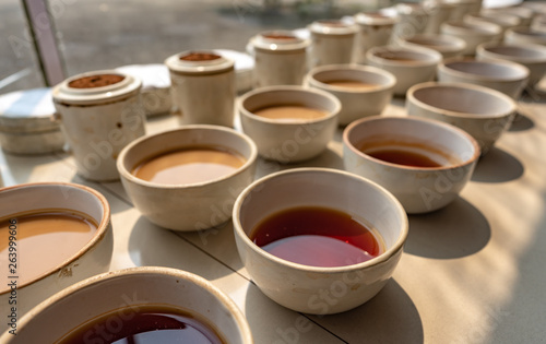 Tea tasting and testing during the manufacturing process at a tea factory in the state of Assam in India