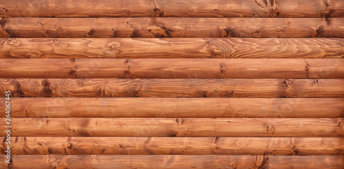 Wooden wall assembled of beams or logs