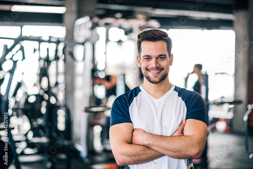 Portrait of a personal trainer in sportswear at the fitness center or gym.