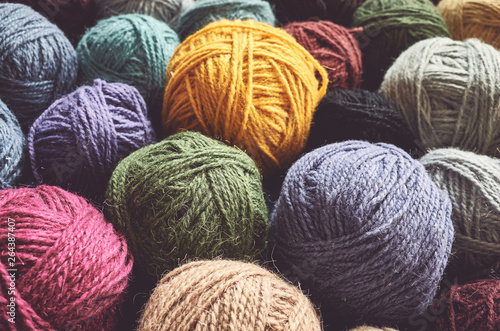 Vintage toned picture of wool yarn balls, shallow depth of field.