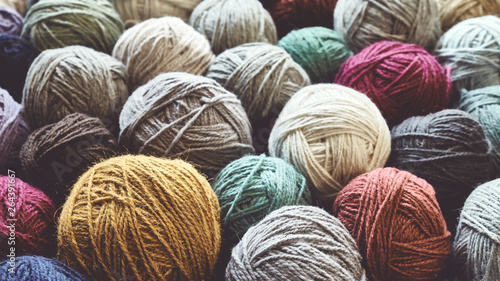 Vintage toned picture of wool yarn balls, shallow depth of field.