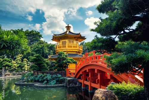 Front view the Golden pavilion temple with red bridge in Nan Lian garden, Hong Kong. Asia.