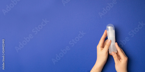 an intimate lubricant on a pastel blue background