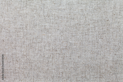 Special cloth for cross-stitch embroidery with square mesh pattern linen canvas. Fabric background. Template for text or advertising sewing and needlework. Top view, flat lay